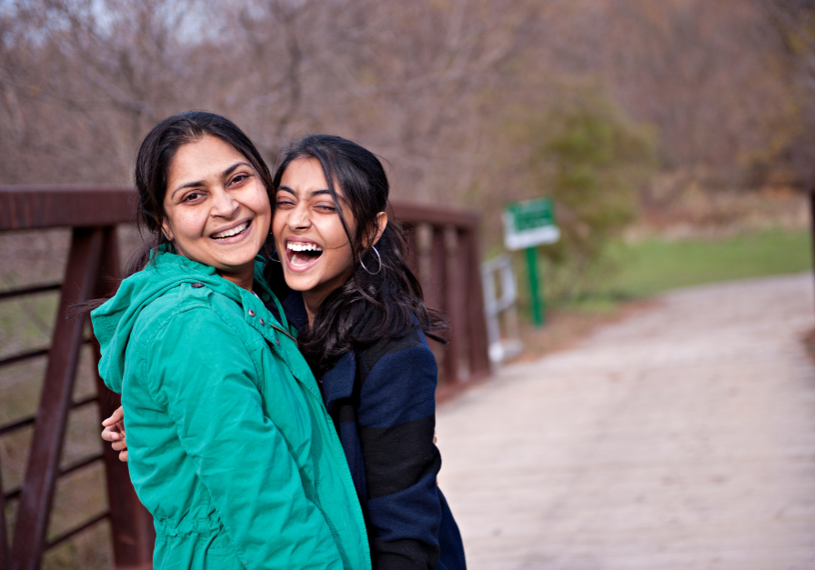 Woman and daughter laughing