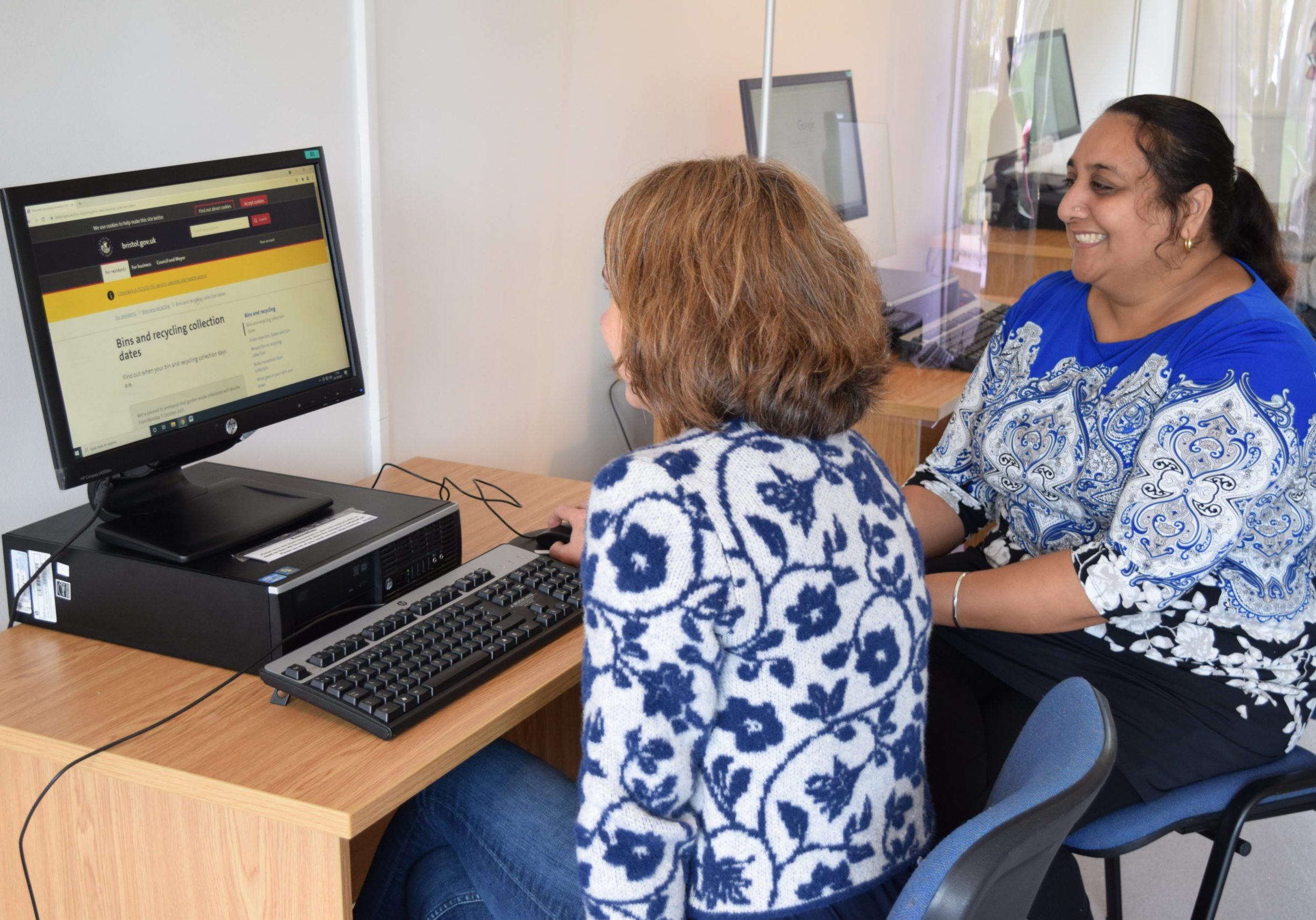 Mentor and client sitting at computer